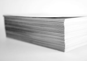 stack of blank sheets of paper on a flat surface